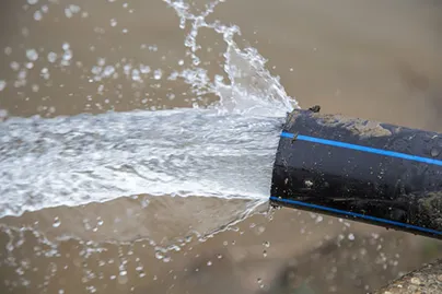 Water pipe with water flowing out of it